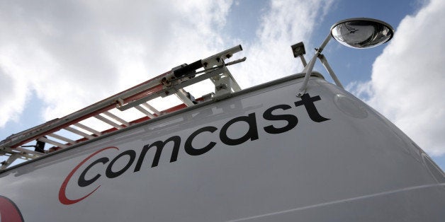 POMPANO BEACH, FL - FEBRUARY 13: A Comcast truck is seen parked at one of their centers on February 13, 2014 in Pompano Beac