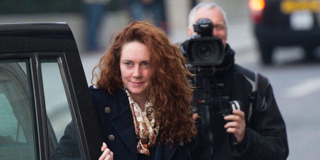 LONDON, ENGLAND - DECEMBER 10: Former News International chief executive Rebekah Brooks arrives for the phone-hacking trial at the Old Bailey on December 10, 2013 in London, England. Downing Street's former director of communications and News Of The World editor Andy Coulson and the former News International chief executive Rebekah Brooks, along with six others, face a series of charges linked to the phone hacking of celebrities and others at the now-defunct newspaper. (Photo by Bethany Clarke/Getty Images)