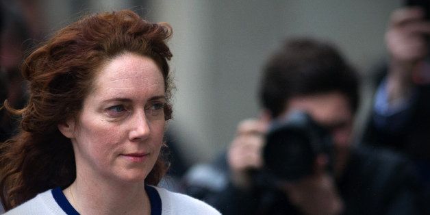 Rebekah Brooks, former News International chief executive arrives for the phone-hacking trial at the Old Bailey court in London on February 20, 2014. Rebekah Brooks, the former editor of the News of the World and the Sun tabloids, was found not guilty Thursday of approving a payment to a public official for a photo of Prince William. Brooks, who rose to become chief executive of News International, Rupert Murdoch's British newspaper division, still faces four other charges in the trial, including for phone hacking. AFP PHOTO / CARL COURT (Photo credit should read CARL COURT/AFP/Getty Images)