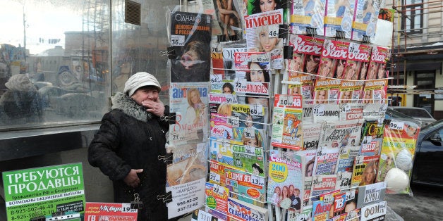 A Russian vendor sells newspapers and magazines in central Moscow on March 3, 2010. AFP PHOTO / NATALIA KOLESNIKOVA (Photo credit should read NATALIA KOLESNIKOVA/AFP/Getty Images)