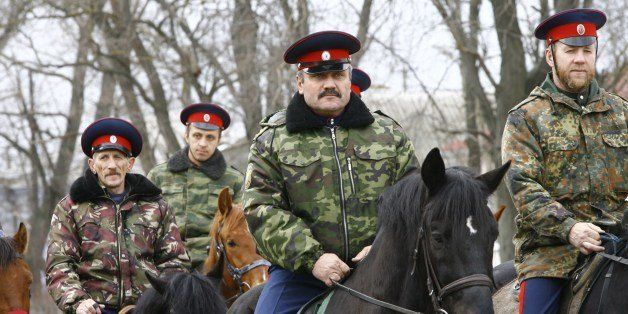 Mounted Cossacks patrol an area near Russian-Ukrainian border near the southern city of Rostov-on-Don, on March 19, 2014. But by snatching Crimea from Ukraine, President Vladimir Putin has shown a readiness to redraw Russia's current frontiers and shatter the order that dates from the so-called Belovezhskaya Accords.AFP PHOTO / ANDREY KRONBERG (Photo credit should read ANDREY KRONBERG/AFP/Getty Images)