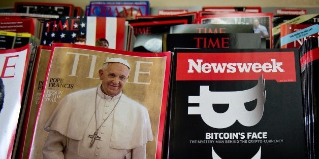 A copy of the new print edition of Newsweek magazine is diplayed in a newsstand in Washington on March 10, 2014. Newsweek, online only since the end of 2012, returned to print on March 7 in the United States and Europe. Parent company IBT Media is taking a gamble in re-launching the once-iconic news weekly, which has nearly disappeared in the face of serious financial difficulties. In crafting its print resurrection, the New York-based online media group, led by French businessman Etienne Uzac, has adopted a strategy that goes against current practices. The new magazine will seek to position itself as a high-end product, in particular with higher quality paper and printing than its competitors. AFP PHOTO/Nicholas KAMM (Photo credit should read NICHOLAS KAMM/AFP/Getty Images)