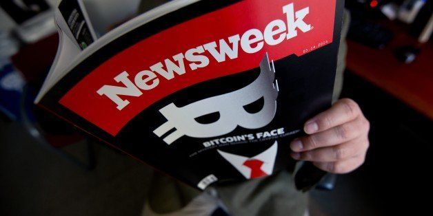 This photo illustration shows a man reading a copy of the new print edition of Newsweek magazine in Washington on March 10, 2014. Newsweek, online only since the end of 2012, returned to print on March 7 in the United States and Europe. Parent company IBT Media is taking a gamble in re-launching the once-iconic news weekly, which has nearly disappeared in the face of serious financial difficulties. In crafting its print resurrection, the New York-based online media group, led by French businessman Etienne Uzac, has adopted a strategy that goes against current practices. The new magazine will seek to position itself as a high-end product, in particular with higher quality paper and printing than its competitors. AFP PHOTO/Nicholas KAMM (Photo credit should read NICHOLAS KAMM/AFP/Getty Images)