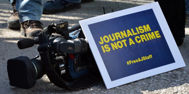 ANKARA - TURKEY - FEBRUARY 27: A group of Al Jazeera Arabic journalists gather to demonstrate outside the Egypt Embassy building demanding the release of Al Jazeera Arabic network journalist Abdullah Al Shami, cameraman Mohamed Badr, Australian journalist Peter Greste and Egyptian-Canadian Mohamed Fadel Fahmy who are being held at Cairo's Tora prison for allegedly supporting the Muslim Brotherhood in capital Ankara, Turkey on February 27, 2014. (Photo by Murat Kula/Anadolu Agency/Getty Images)