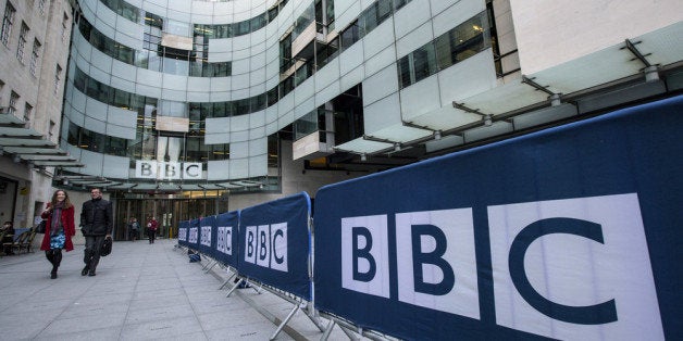 LONDON, ENGLAND - MARCH 25: People walk past Broadcasting House, the headquarters of the BBC, on March 25, 2014 in London, E