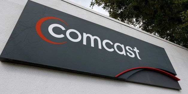 POMPANO BEACH, FL - FEBRUARY 13: A Comcast sign is seen at one of their centers on February 13, 2014 in Pompano Beach, Florida. Today, Comcast announced a $45-billion offer for Time Warner Cable. (Photo by Joe Raedle/Getty Images)