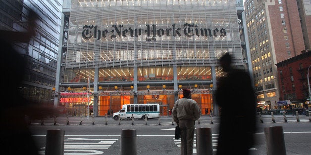 NEW YORK - DECEMBER 07: The New York Times' masthead is displayed in front of the midtown headquarters on December 7, 2009 in New York City. Today is the deadline for Times staffers to accept a buyout package in an effort to eliminate 100 newsroom employees this year in the struggling economy. The newspaper will likely fall short of the 100 buyouts and will need to layoff staffers to cut costs. (Photo by Mario Tama/Getty Images)