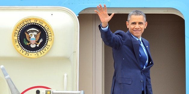 US President Barack Obama boards Air Force One as he leaves South Korea at Osan Air Base in Pyeongtaek, south of Seoul, on April 26, 2014. North Korea is a 'pariah state' whose heavily militarised border with the South marks 'freedom's frontier', US President Barack Obama told American troops in Seoul on April 26. AFP PHOTO / JUNG YEON-JE (Photo credit should read JUNG YEON-JE/AFP/Getty Images)