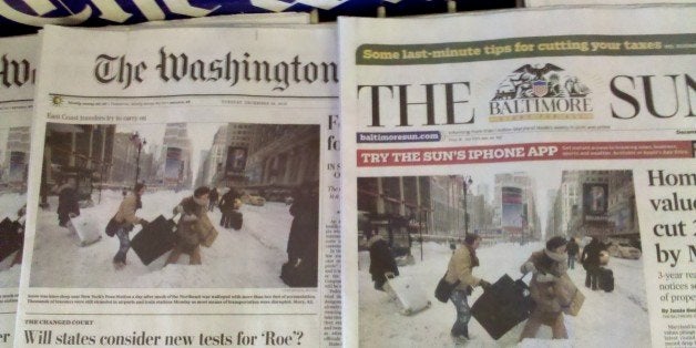 Identical photos on the front pages of both the Washington Post and the Baltimore Sun