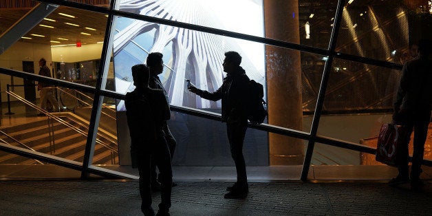 NEW YORK, NY - MAY 19: People walk the grounds at the Ground Zero memorial site after authorities recently took down gates and opened the plaza to the public on May 19, 2014 in New York City. Visitors previously had to wait in line to enter a barricaded area which includes the newly dedicated National September 11 Memorial Museum. Together with the museum, Ground Zero has become one of the top tourist attractions in the nation with tens of thousands of visitors expected yearly. The museum will open to the general public this Wednesday. (Photo by Spencer Platt/Getty Images)