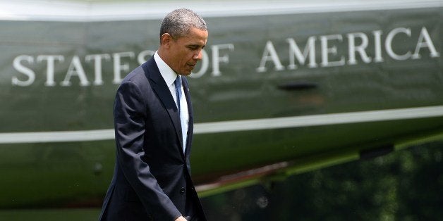 US President Barack Obama walks to the Oval Office at the White House in Washington, DC, on May 28, 2014 upon returning from