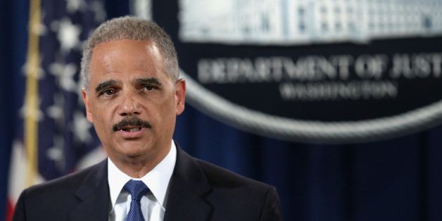 WASHINGTON, DC - MAY 19: U.S. Attorney General Eric Holder speaks during a news conference at the Justice Department May 19, 2014 in Washington, DC. Swiss financial services holding company Credit Suisse AG has pleaded guilty to conspiracy to aid and assist U.S. taxpayers in filing false income tax returns and other documents with the IRS and has agreed to pay $2.6 billion in fine. (Photo by Alex Wong/Getty Images)