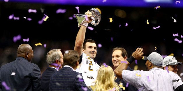 NEW ORLEANS, LA - FEBRUARY 03: Joe Flacco #5 of the Baltimore Ravens holds up the Vince Lombardi Trophy in front of CBS host Jim Nantz following their 34-31 win against the Baltimore Ravens during Super Bowl XLVII at the Mercedes-Benz Superdome on February 3, 2013 in New Orleans, Louisiana. (Photo by Al Bello/Getty Images)
