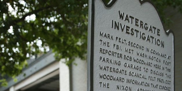ARLINGTON, VA - AUGUST 27: A historical marker stands next to the entrance of the parking garage where Washington Post reporter Bob Woodward held late night meetings with Deep Throat, his Watergate source who later turned out to be Mark Felt, the FBI's former No. 2 official, August 27, 2013 in Arlington, Virginia. A property developer plans to demolish the 60s era office building and the underground garage. (Photo by Mark Wilson/Getty Images)