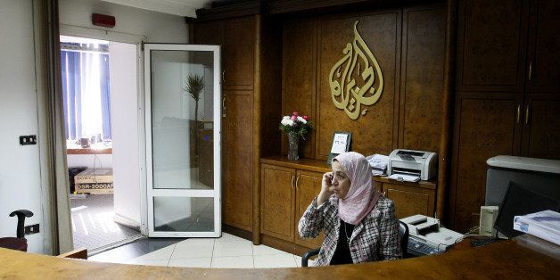An Al-Jazeera employee talks on the phone at the pan-Arab television channel's bureau in Cairo on January 30, 2011. Egypt has ordered a shutdown of Al-Jazeera's operations, the official MENA news agency said, after the channel gave blanket coverage to ongoing anti-government protests. AFP PHOTO/MOHAMMED ABED (Photo credit should read MOHAMMED ABED/AFP/GettyImages)