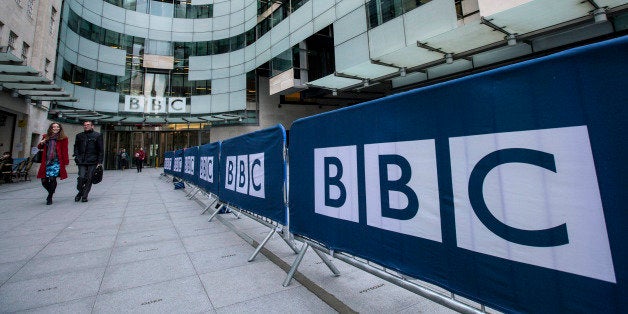 LONDON, ENGLAND - MARCH 25: People walk past Broadcasting House, the headquarters of the BBC, on March 25, 2014 in London, E