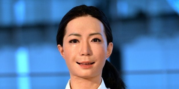 The new humanoid robot named 'Otonaroid' gestures during a press preview at the National Museum of Emerging Science and Technology in Tokyo on June 24, 2014. Japanese scientists unveiled what they said was the world's first news-reading android, eerily lifelike and possessing a sense of humour to match her perfect language skills. AFP PHOTO / Yoshikazu TSUNO (Photo credit should read YOSHIKAZU TSUNO/AFP/Getty Images)