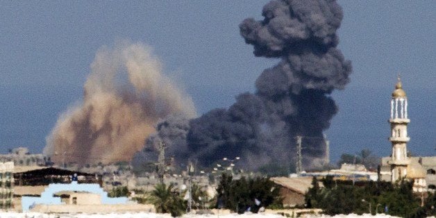 A picture taken from the Israeli border with the Gaza Strip shows smoke billowing from the coastal Palestinian enclave following an Israeli air strike on July 16, 2014. New Israeli air and tank strikes in Gaza killed several people, medics said, bringing the death toll from Israel's operation in the besieged Palestinian territory to 205. AFP PHOTO / JACK GUEZ (Photo credit should read JACK GUEZ/AFP/Getty Images)