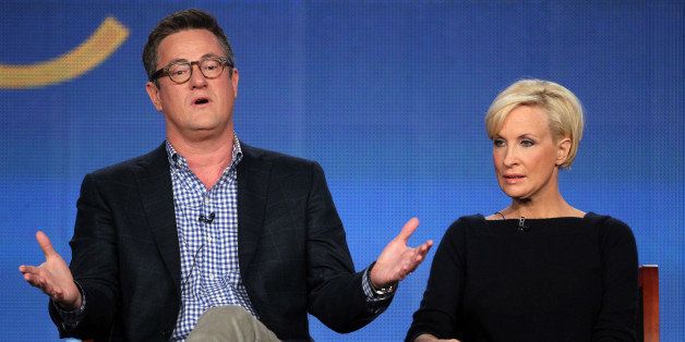 PASADENA, CA - JANUARY 07: (L-R) Host Joe Scarborough and co-host Mika Brzezinski speak onstage during the 'Morning Joe' panel during the NBCUniversal portion of the 2012 Winter TCA Tour at The Langham Huntington Hotel and Spa on January 7, 2012 in Pasadena, California. (Photo by Frederick M. Brown/Getty Images)