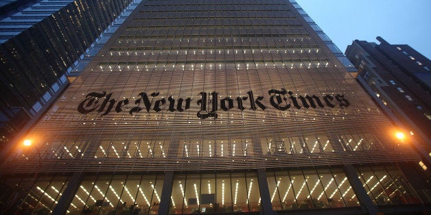 NEW YORK - DECEMBER 07: The New York Times' masthead is displayed in front of the midtown headquarters on December 7, 2009 in New York City. Today is the deadline for Times staffers to accept a buyout package in an effort to eliminate 100 newsroom employees this year in the struggling economy. The newspaper will likely fall short of the 100 buyouts and will need to layoff staffers to cut costs. (Photo by Mario Tama/Getty Images)