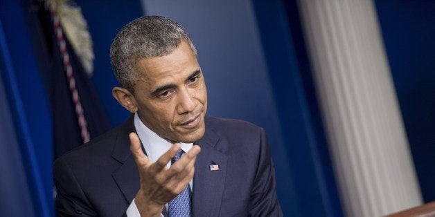 US President Barack Obama answers questions in the briefing room of the White House August 1, 2014 in Washington, DC. AFP PHO