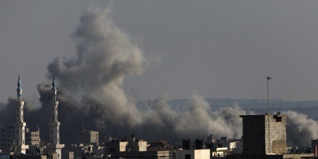 Smoke billows following an Israeli military strike on Gaza City on August 8, 2014. Israeli warplanes pounded targets across Gaza, where at least five Palestinians were killed and militants fired dozens of rockets into Israel after renewed hostilities ruptured a fledgling three-day truce. AFP PHOTO / MAHMUD HAMS (Photo credit should read MAHMUD HAMS/AFP/Getty Images)