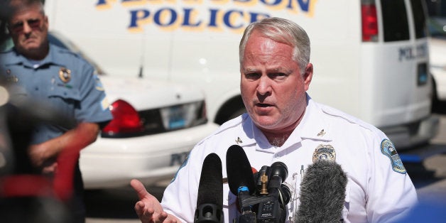 FERGUSON, MO - AUGUST 13: Police Chief Thomas Jackson fields questions related to the shooting death of teenager Michael Brown during a press conference on August 13, 2014 in Ferguson, Missouri. Brown was shot and killed by a Ferguson police officer on Saturday. Ferguson has experienced three days of violent protests since the killing. (Photo by Scott Olson/Getty Images)