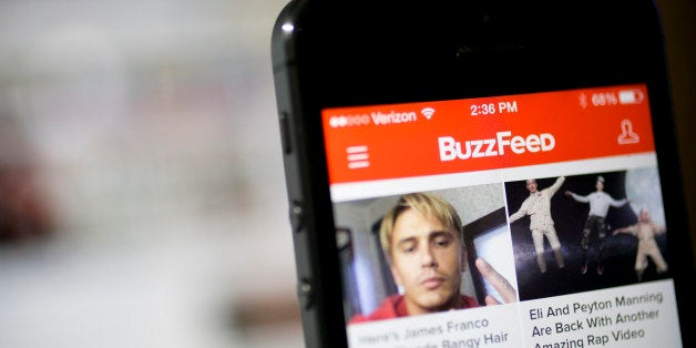 The Buzzfeed Inc. application (app) is displayed on an Apple Inc. iPhone 5s in this arranged photograph in Washington, D.C.,