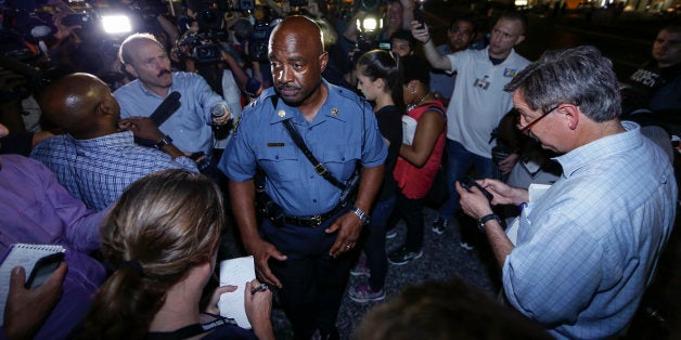 FERGUSON, UNITED STATES - AUGUST 18: Captain Ron Johnson of the Missouri Highway Patrol speaks to media during a protest on August 18, 2014 for Michael Brown, who was killed by a police officer on August 9 in Ferguson, United States. Captain Ronald Johnson of the Missouri State Highway Patrol, makes statements to reporters as the protests continue in Ferguson. Some of the protesters were detained by the police during the clashes on Monday. The 18 year-old Brown was killed in a confrontation with a police officer in the St. Louis suburb of Ferguson, Missouri on August 09, 2014. Details of the fatal encounter continue to be disputed but racial tensions flared between the majority black community and predominantly white police force following his death. (Photo by Bilgin Sasmaz/Anadolu Agency/Getty Images)