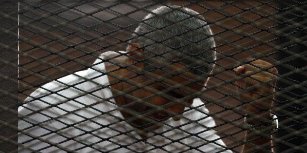 CAIRO, EGYPT - JUNE 23: An Egyptian court on Monday, June 23, handed out jail terms ranging from three to ten years each to 18 people, including four foreign Al Jazeera journalists convicted of 'fabricating news', eleven defendants including three foreign correspondents including Egyptian-Canadian Mohamed Fadel Fahmy (Seen), were sentenced in absentia to ten years each in jail. Seven others, including Australian Al Jazeera journalist Peter Greste, were sentenced to seven years each. (Photo by Stringer/Anadolu Agency/Getty Images)