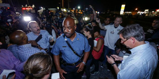 FERGUSON, UNITED STATES - AUGUST 18: Captain Ron Johnson of the Missouri Highway Patrol speaks to media during a protest on August 18, 2014 for Michael Brown, who was killed by a police officer on August 9 in Ferguson, United States. Captain Ronald Johnson of the Missouri State Highway Patrol, makes statements to reporters as the protests continue in Ferguson. Some of the protesters were detained by the police during the clashes on Monday. The 18 year-old Brown was killed in a confrontation with a police officer in the St. Louis suburb of Ferguson, Missouri on August 09, 2014. Details of the fatal encounter continue to be disputed but racial tensions flared between the majority black community and predominantly white police force following his death. (Photo by Bilgin Sasmaz/Anadolu Agency/Getty Images)