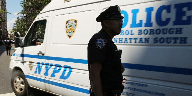 NEW YORK, NY - JULY 28: Police stand near where two U.S. Marshals and one New York Police Department...