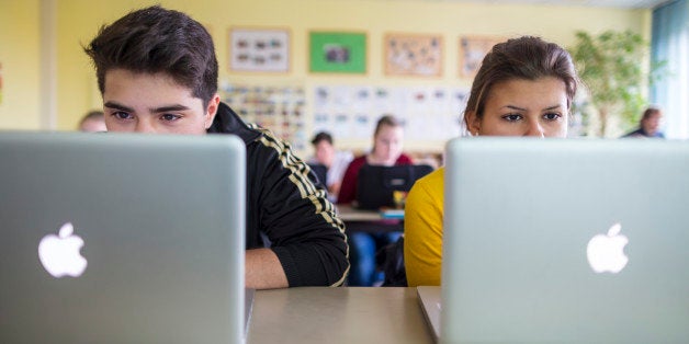 BERLIN, GERMANY - OCTOBER 25: Pupils working at their lap-tops in a lesson at the Heinrich-Mann-School in the Neukoelln district of Berlin, Germany on October 25, 2012. (Photo by Thomas Trutschel/Photothek via Getty Images)