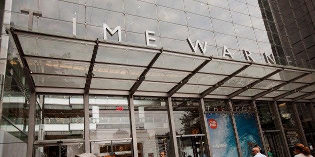 Pedestrians walk past the Time Warner Center in New York, U.S., on Monday, July 21, 2014. Rupert Murdoch's 21st Century Fox I