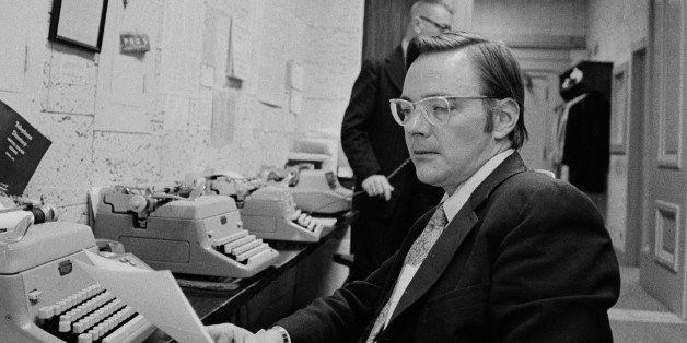 American broadcast journalist Bruce Morton sits in front of a bank of typewriters and reads copy, February 2, 1972. (Photo by CBS Photo Archive/Getty Images) 