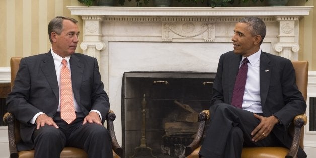 US President Barack Obama (R) talks with Speaker of the House, John Boehner, R-Ohio, during a meeting with the bipartisan, b