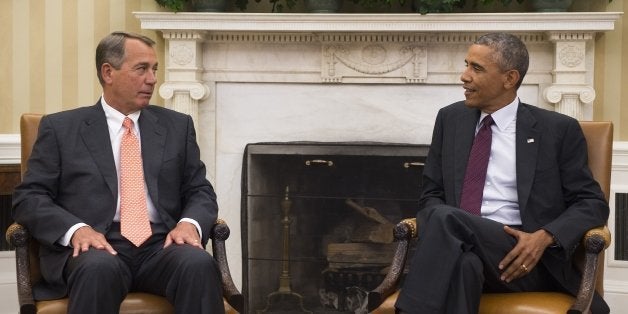 US President Barack Obama (R) talks with Speaker of the House, John Boehner, R-Ohio, during a meeting with the bipartisan, bicameral leadership of Congress in the Oval Office of the White House in Washington, DC, September 9, 2014. President Obama will speak to the nation September 10, about the strategy White House intends to implement to counter the jihadist Islamic state. AFP PHOTO / Jim WATSON (Photo credit should read JIM WATSON/AFP/Getty Images)