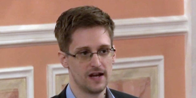 FILE - In this file image made from video released by WikiLeaks on Friday, Oct. 11, 2013, former National Security Agency systems analyst Edward Snowden speaks during a presentation ceremony for the Sam Adams Award in Moscow, Russia. Snowden was awarded the Sam Adams Award, according to videos released by the organization WikiLeaks. The award ceremony was attended by three previous recipients. (AP Photo, File)