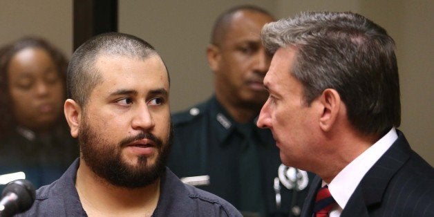 George Zimmerman, acquitted in the high-profile killing of unarmed black teenager Trayvon Martin, faces his defense counsel Jeff Dowdy in court Tuesday, Nov. 19, 2013, in Sanford, Fla., during his hearing on charges including aggravated assault stemming from a fight with his girlfriend. (AP Photo/Orlando Sentinel, Joe Burbank, Pool)