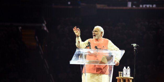 Prime Minister Narendra Modi of India speaks to supporters during a community reception September 28, 2014 at Madison Square Garden in New York. Modi received a rock star reception as thousands cheered on the new right-wing leader in a packed arena. Modi, a Hindu nationalist who swept to power earlier this year, addressed the United Nations on September 27 at the start of a visit to the United States, which is eager to court him after shunning the right-wing leader for a decade. AFP PHOTO/Don Emmert (Photo credit should read DON EMMERT/AFP/Getty Images)