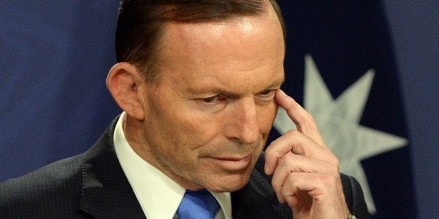 Australia's Prime Minister Tony Abbott gestures during a press conference in Sydney on September 19, 2014. Australia stepped up an anti-terror crackdown on with the deployment of armed police inside parliament in the face of threats from extremists after foiling a plot by Islamic State jihadists for 'demonstration executions'. AFP PHOTO / Saeed KHAN (Photo credit should read SAEED KHAN/AFP/Getty Images)