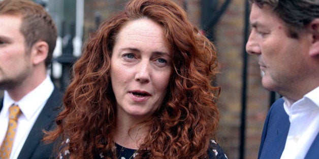 Rebekah Brooks, former chief executive officer of News International Ltd., center, speaks to the media in London, U.K., on Th