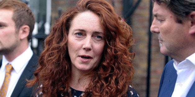 Rebekah Brooks, former chief executive officer of News International Ltd., center, speaks to the media in London, U.K., on Thursday, June 26, 2014. Brooks said she was vindicated by a jury's decision to acquit her as she spoke publicly for the first time since the verdicts cleared her of all charges against her relating to phone hacking, bribery and perverting the course of justice. Photographer: Chris Ratcliffe/Bloomberg via Getty Images 