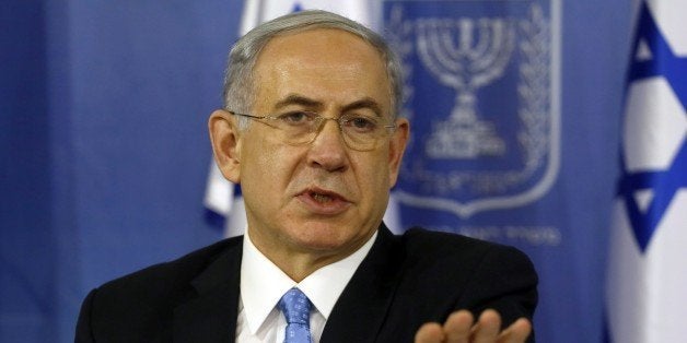 Israeli Prime Minister Benjamin Netanyahu gestures as he speaks during a joint press conference with Defense Minister (unseen