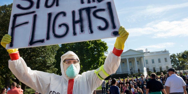 Jeff Hulbert, of Annapolis, Md., protests U.S. handling of Ebola cases outside of the White House Friday, Oct. 17, 2014, in W