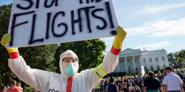 Jeff Hulbert, of Annapolis, Md., protests U.S. handling of Ebola cases outside of the White House Friday, Oct. 17, 2014, in Washington. (AP Photo/Jacquelyn Martin)