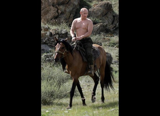 vladimir putin riding a dinosaur