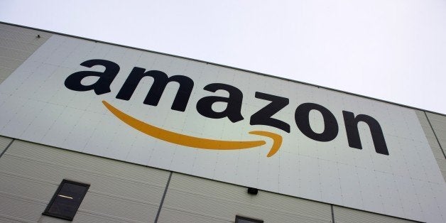 The logo of US online retail giant Amazon is displayed on the Brieselang logistics center, west of Berlin on November 11, 2014. The center is one of nine in Germany. AFP PHOTO / JOHN MACDOUGALL (Photo credit should read JOHN MACDOUGALL/AFP/Getty Images)