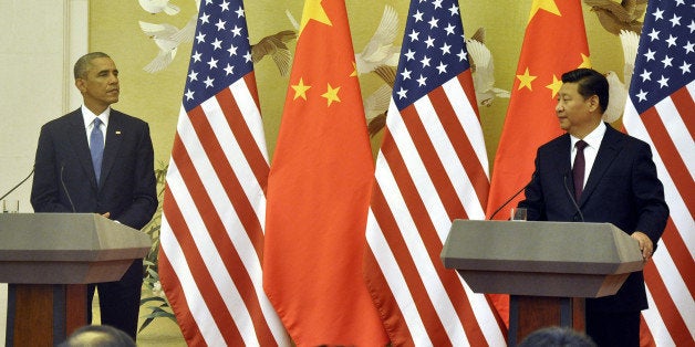 BEIJING, CHINA - NOVEMBER 12: U.S. President Barack Obama (L) and Chinese President Xi Jinping (R) hold a press conference at the Great Hall of the People in Beijing, China, on November 12, 2014. (Photo by Tevfik Durul/Anadolu Agency/Getty Images)