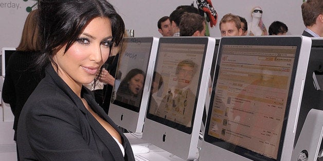 NEW YORK - NOVEMBER 19: TV personality Kim Kardashian shops on an eBay computer kiosk inside the eBay Holiday Store on November 19, 2009 in New York City. (Photo by Michael Loccisano/Getty Images for eBay)